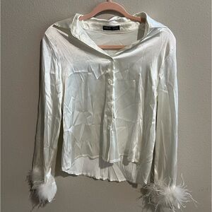 White long sleeve button up with feathers end of sleeve. Brand Shein. Size XS.